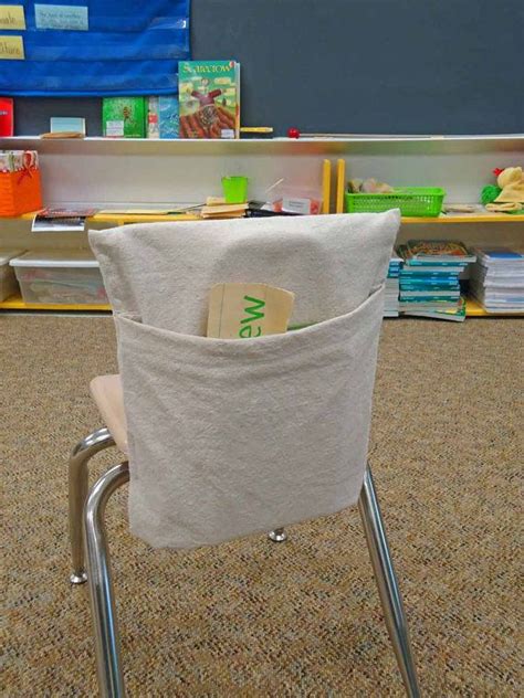 Using a strip of satin, tie a decorative bow in the middle and slip over the back of a chair. Teachers LOVE Me - Classroom Chair Book Pocket - DIY ...