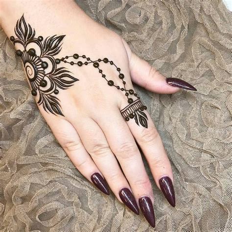 The symbol of a scissor expresses different things. Tattoos on back (With images) | Henna finger tattoo, Henna ...