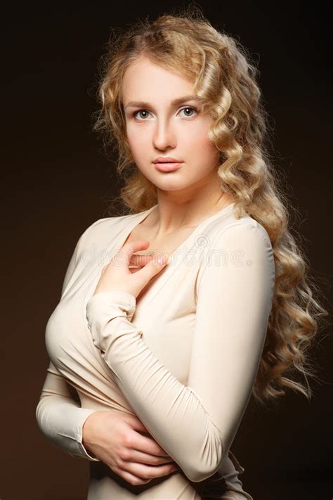 Keep it voluminous and polished. Lovely Model With Shiny Volume Curly Hair Stock Photo ...