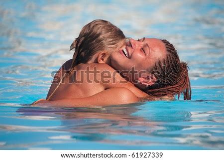 Kensington pool will not reopen during the pandemic. Couple Hugging Kissing Under Waterfall Stock Photo ...