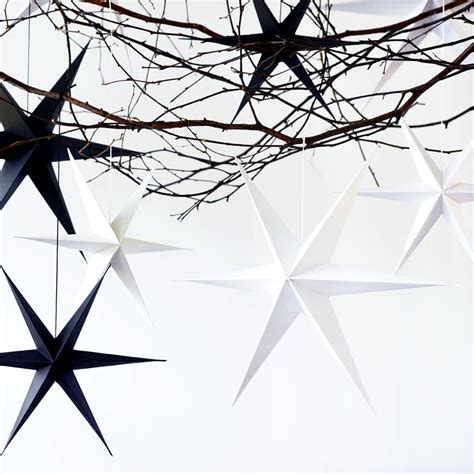 These are going to dazzle your christmas tree decorations. Silver Glitter Paper Star Decorations By Peach Blossom | notonthehighstreet.com