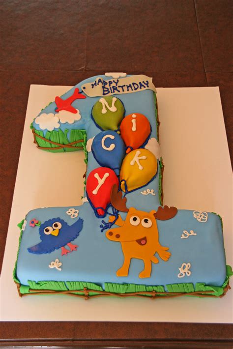 Birthday cakes have gone through a revolution over time. Moose & Zee First Birthday Cake - Nicky | A first birthday c… | Flickr