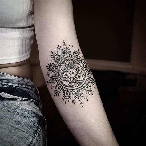 Inner elbow tattoos for guys. Inner elbow tattoo of a ornamental mandala.