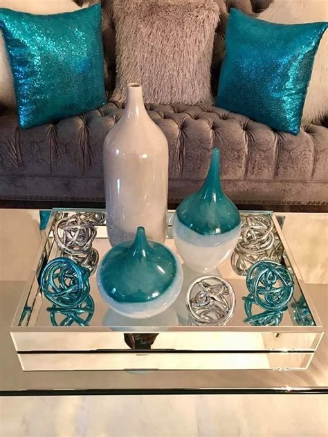 The living room's floors were so stained that she needed a dark shade to hide their flaws. Silver and teal decor in 2020 | Teal living room decor ...