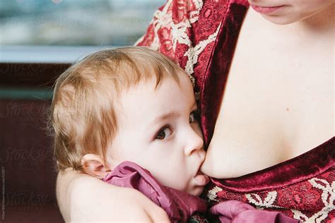 Both victims were taken to a local hospital, where the mother died. Closeup Of A Young Mother Breastfeeding Her Daughter by ...