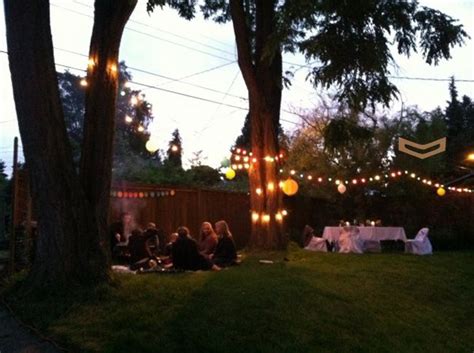 Scatter some lanterns on the table, too, in order to achieve an outdoor candlelight glow. summer backyard party | Backyard party lighting, Backyard ...