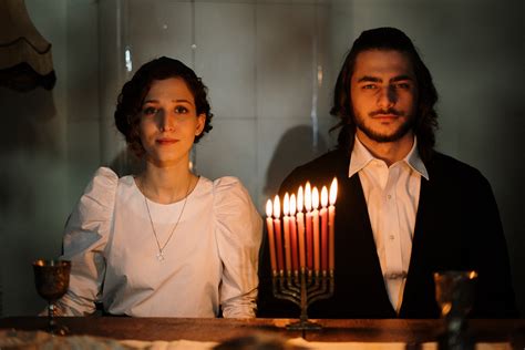Jewish Couple With a Menorah · Free Stock Photo