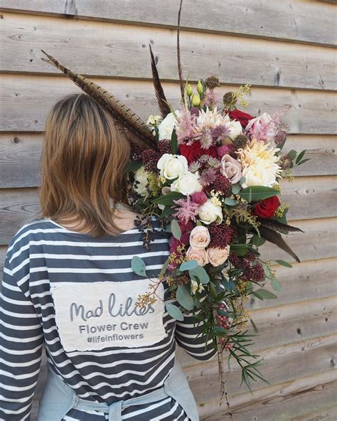 How to make a bohemian styled bouquet with peonies. Lucys cascade bouquet complete with pheasant feathers ...