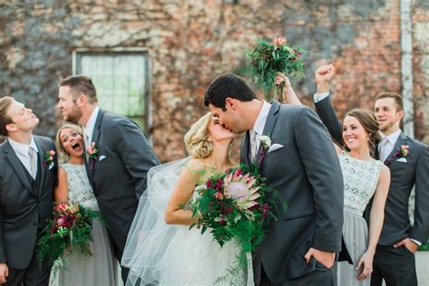 Young couple of newlyweds kissing in spring garden. Spring Garden Wedding | POPSUGAR Love & Sex