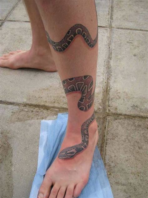 For ancient celts and some other cultures, the snake was a. Awesome snake wrapped around leg tattoo - Tattooimages.biz