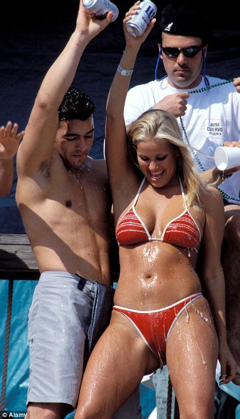 Spring break is for college students not hs students. A couple pour beer over themselves as they dance in Panama ...