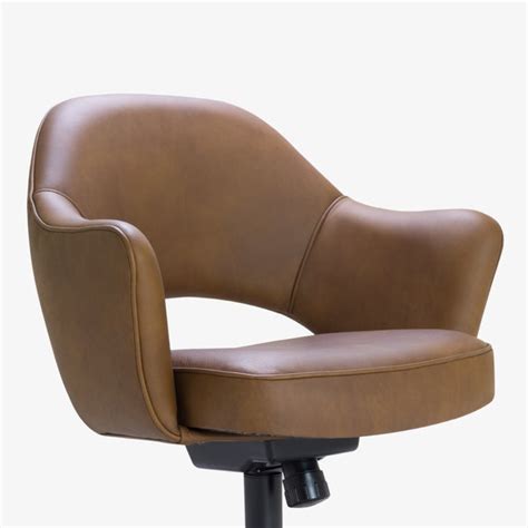His luxurious and sculptural executive side chair and the matching executive armchair were the results. Saarinen Executive Arm Chair in Saddle Leather, Swivel ...