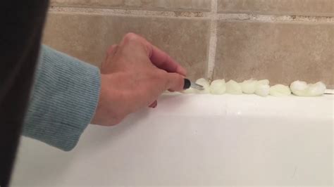 Over time the caulk or grout around your tub or shower needs to be replaced. How to Clean caulk and grout around the bathtub - YouTube