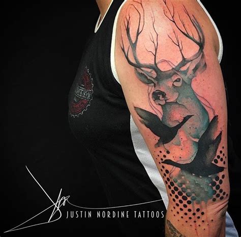 Make a note of the use of psychedelic colors that are merged together like a perfect collage. Justin Nordine deer tattoo