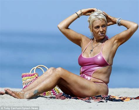 This teen nudist strips bare at a public beach. Tanning Mom Patricia Krentcil hits beach in cut-out ...