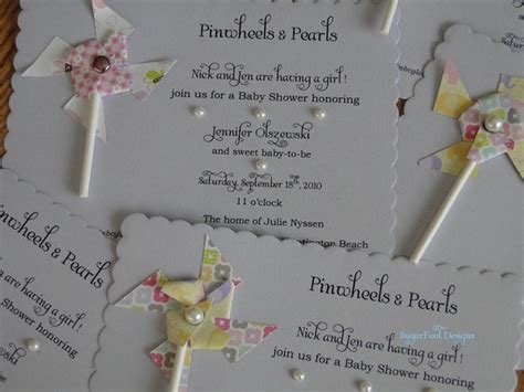 Buy inexpensive baby items like a pacifier or dummy, write your invitation details on to small tags, punch a hole in the tag and tie it to the pacifier. 10 Cute Baby Shower Invitation Ideas