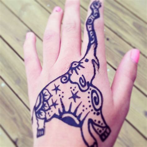 Henna tattoos go through a color shift from the time they are done until the time they disappear. Elephant Henna | Hand tattoos, Hand henna, Henna