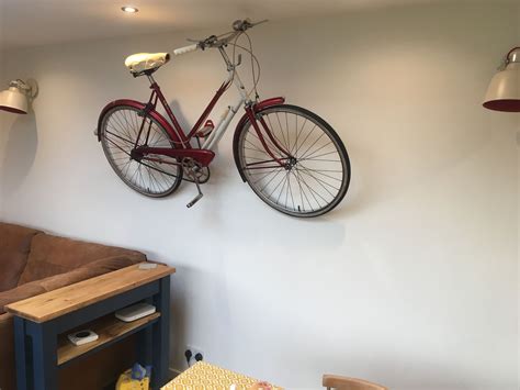 Reflections metal bicycle wall décor, polished finish, classic bicycle model, red iron frame with passenger seat, silver headlight and signal lights this unique wall piece is sure to be a conversation starter no matter what room you choose to display it. Vintage Raleigh bike bicycle hung on the wall, unusual ...