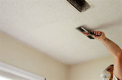 Scraping popcorn ceilings starts with using a spray bottle, a wide scraper and plastic. D-I-Y Popcorn Ceiling Removal