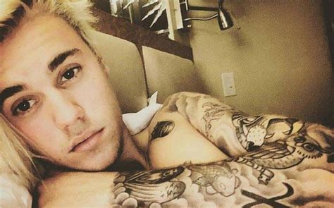 Everything's coming up roses for justin bieber—quite literally. Justin Bieber's face tattoo is so small, you need a microscope to see it : Celebrity, News ...