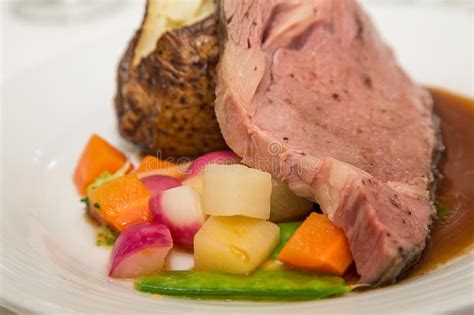 A ribeye is the section of the rib roast. Prime Rib With Baked Potato And Mixed Vegetables Stock Image - Image of cuisine, baked: 46542203