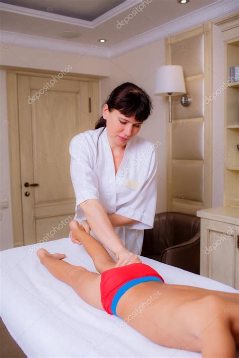 Once we notice visitors from facebook to shared place, it gets promoted for 3 months free! Doctor massaging little boy — Stock Photo © HannaNes #49026303