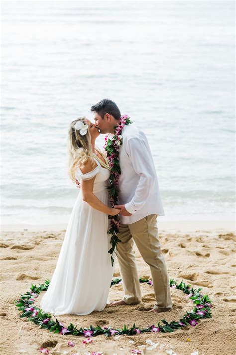 Whether you're looking to plan a celebrity worthy wedding ceremony or hold an intimate beach vow renewal, we're here to help. Tropical Wedding on a Hawaiian Beach. Couple honi (kiss ...