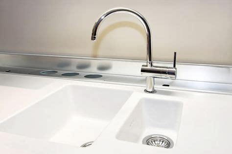 Dip a sponge in the solution to soak it with soapy water and wipe down the countertop in circular motions to clean it. From Martha Stewart Radio: Removing Stains from Corian ...