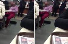 woman caught masturbating public mcdonald herself her inside while touch genitals touches self appears videos repeatedly