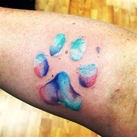 #pawprinttattoo #watercolor #watercolortattoo #colour #colourtattoo #pettattoo #therisingtidetattoocollective #tattoo #vegantattoo #vegan #vegantattooartist #guyswithtattoos #guyswithink #girlswithink #girlswhotattoo #girlswithtattoos #tattooapprentice. Watercolor paw print done by Alisha Morgan at Elysium ...