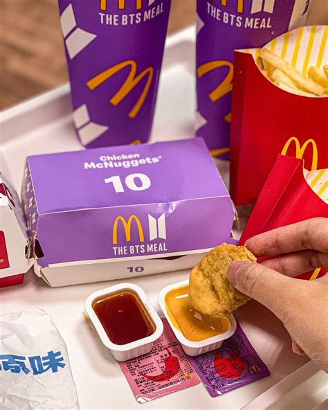 Now, hybe merch has officially released their own designs for bts x mcdonald's. McDonald's BTS Meal Launches On 21 June With Two New Sauces