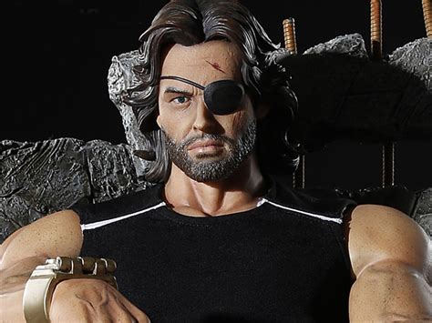 He just lives in some kind of distorted version of our world. Escape From New York Snake Plissken Statue