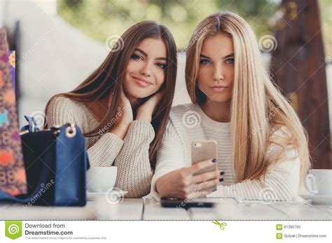 Anal, amateur, big cock, blowjob, gangbang, handjob, group sex, lingerie, bukkake, hardcore. Two Girls Are Watching Photos On Smartphone Stock Photo ...