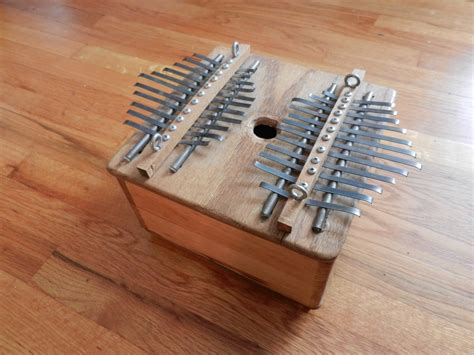 Touch device users, explore by touch or with swipe gestures. Double Kalimba | Weird Instrument Workshop