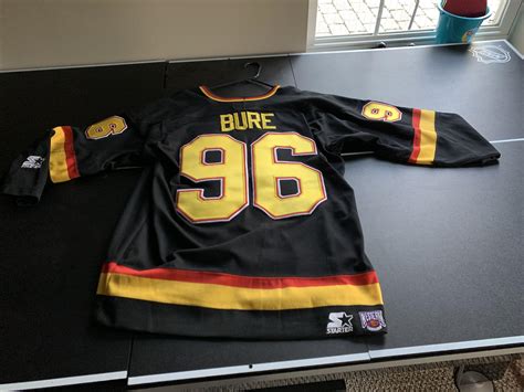 Canucks cup and training camp. Any idea how much this is worth? Canucks #96 Bure jersey ...