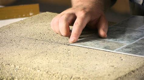 Continue laying the tiles until you have filled up the box. How to Lay Stick Down Vinyl Tiles on Concrete Floors ...
