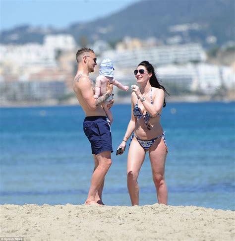 Dele alli of england poses for a portrait during the official fifa world cup 2018 portrait session at on june 13, 2018 in saint petersburg. Dele Alli embraces model Ruby Mae as they holiday in Ibiza ...