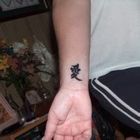 The graceful way the tattoo fits on the ankle and the unique. Chinese symbol tattoo on ankle - Tattooimages.biz