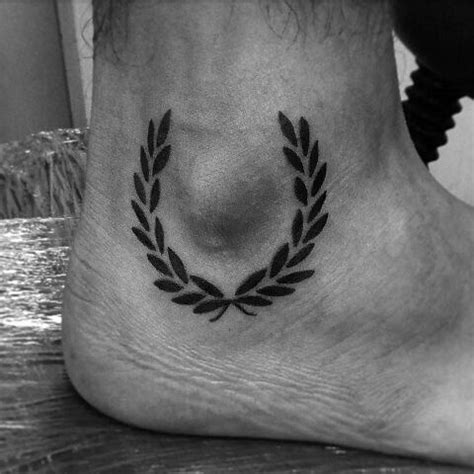 Throughout history, laurel leaves have symbolized nobility, triumph, and victory; 60 Laurel Wreath Tattoo Designs For Men - Branch Ink Ideas