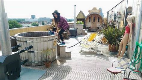 They also have a counter to buy treats and coffee. Rooftop view of hottubs and sauna. - Picture of Volkshotel ...