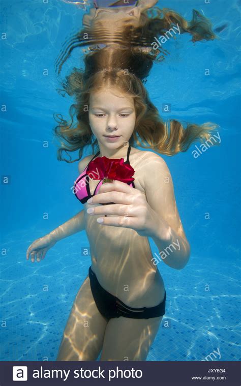 The hotel opened in december, with the pool receiving the accolade for highest outdoor infinity pool in a building earlier this month. Beautiful teen girl posing under water in the pool Stock ...