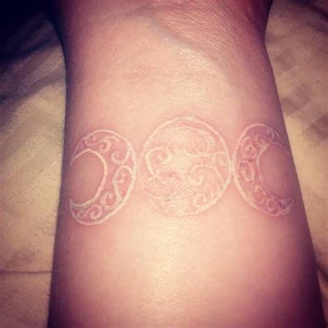 A triple moon tattoo styled in watercolor. Triple Moon, Triple Goddess | Scarification tattoo ...