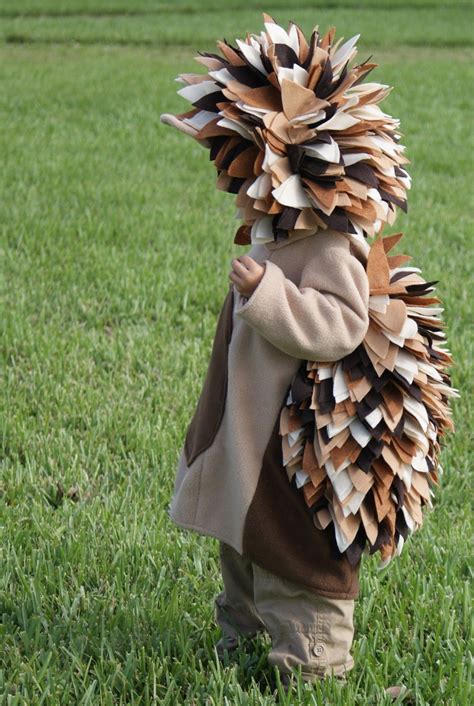 Newborn baby in hedgehog costume sleeping in a hollow tree trunk. Hedgehog In Costume Love their costumes and it | Diy ...