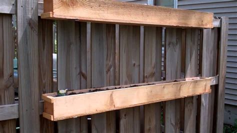 Placing flowering plants on a fence helps disguise a boring or downright ugly blank space while making the most of a. Fence Mounted Garden Boxes - YouTube (With images ...