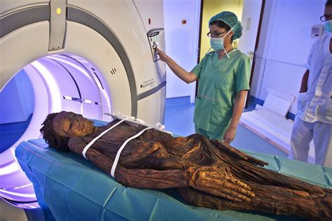 The person lies on a table that moves through a scanning ring, which looks like a large doughnut. A Night Out of the Museum: Mummies In The CT Scanner - GE ...