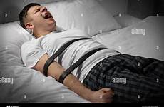 tied bed man alamy young stock belts photography