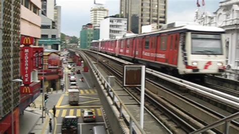 Kl monorail terintegrasi dengan lrt di stasiun hang tuah. Malaysia/KL: An Ampang Line LRT arrives at Masjid Jamek ...