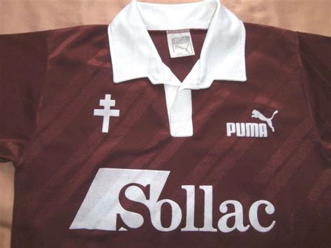 Metz blev etableret i 1993, hvor reklamegaver typisk var nylontasker med firmalogo. FC Metz Home football shirt 1988 - 1989.