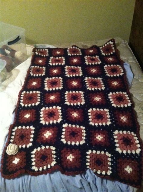 Made for another daughter for her birthday. Granny square lap blanket. Maroon cream and navy blue ...