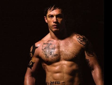 The leprechaun now covered with tribal tattoo surrounding it on his right bicep. How Tom Hardy got ripped for Warrior - Men's Health